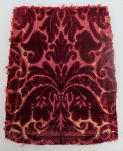 Chair cover in red cicel&eacute; velvet in silk (17th century, Europe; TRC 2011.0368).