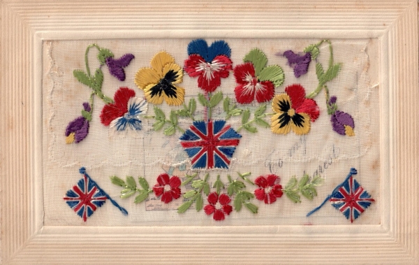 Silk embroidered postcard from the First World War, with pansies and British flags.