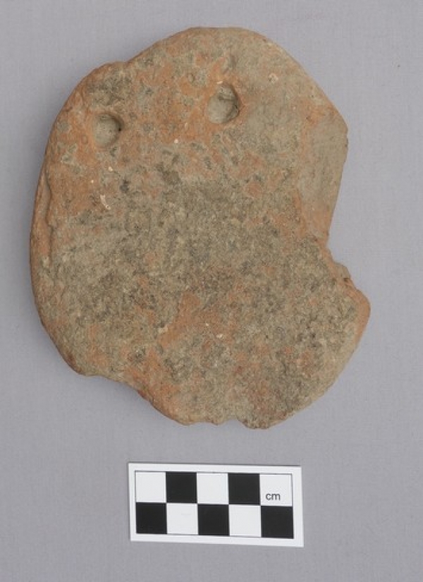 Roman-period loom weight from Greece, made of clay.