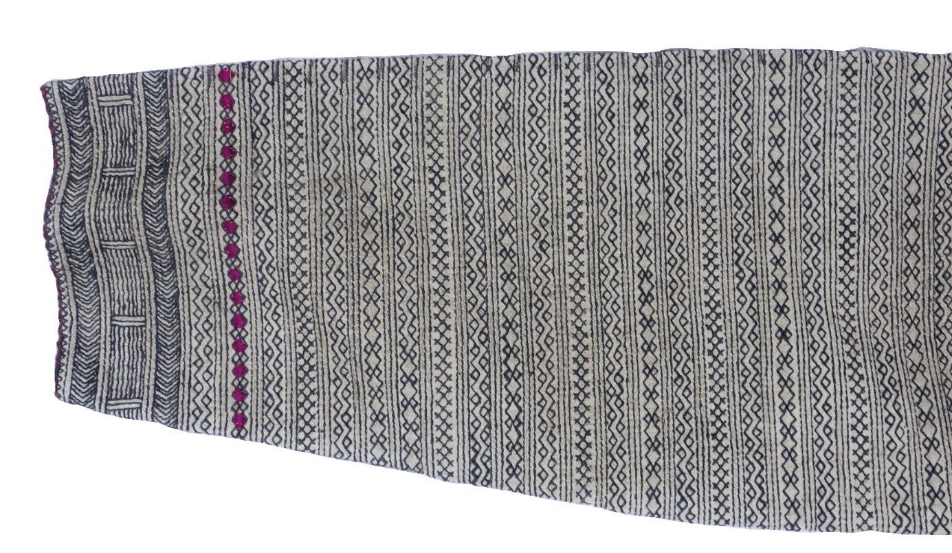 Detail of the sleeve of Pashai shirt, TRC 2018.2581.