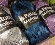 Balls of metallic yarns.