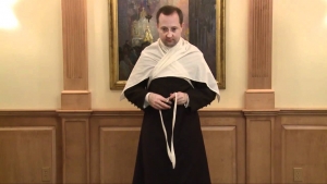 Priest putting on the amice.