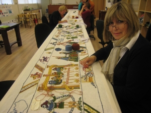 Embroiderers working the Nj&aacute;ls Saga tapestry.