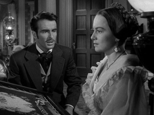 Catherine Sloper (played by Olivia de Havilland) behind her embroidery in the film 'The Heiress', 1949, based on the novel Washington Square, by James Irvin.