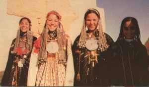 Siwa girls in their family's bridal outfits, late 20th century.