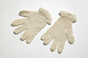 Pair of girls' gloves, early 20th century; crocheted cotton with tatted edging.