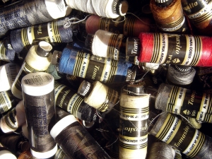 Spools of mercerised cotton threads.