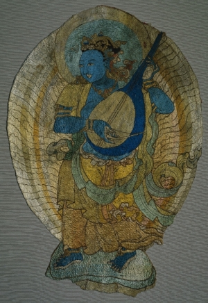Panel with celestial musician, Central Asia, 14th century.