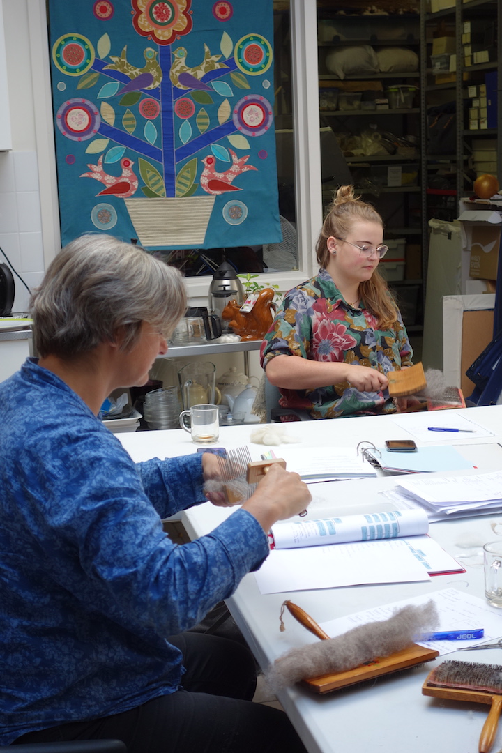Carding and combing at the September 2020 edition of the five-day TRC Intensive Textile Course. Photograph: Augusta de Gunzbourg. The author of this blog is sitting to the left.