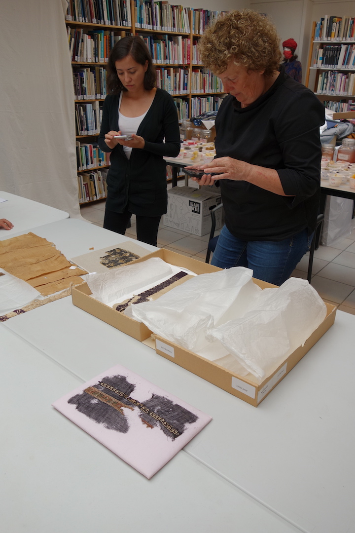 Examining archaeological from Egypt, at the September 2020 edition of the five-day TRC Intensive Textile Course. Photograph: Augusta de Gunzbourg.
