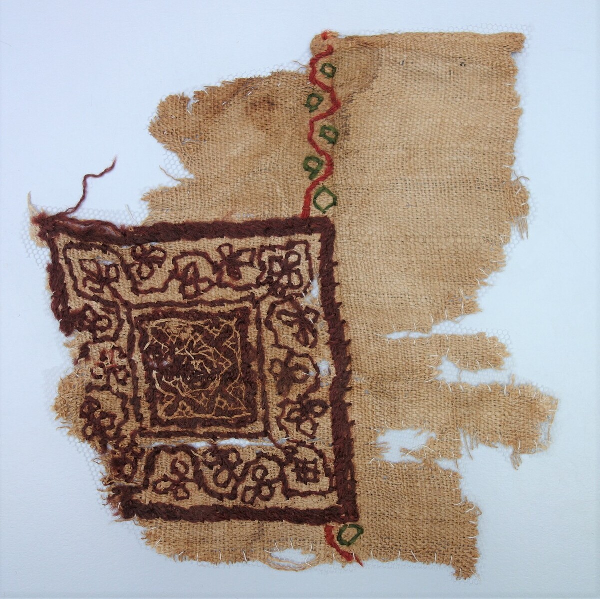 Fragment of woollen embroidery from Coptic Egypt with an embroidered design. 5th-6th c. (TRC 2000.0014).