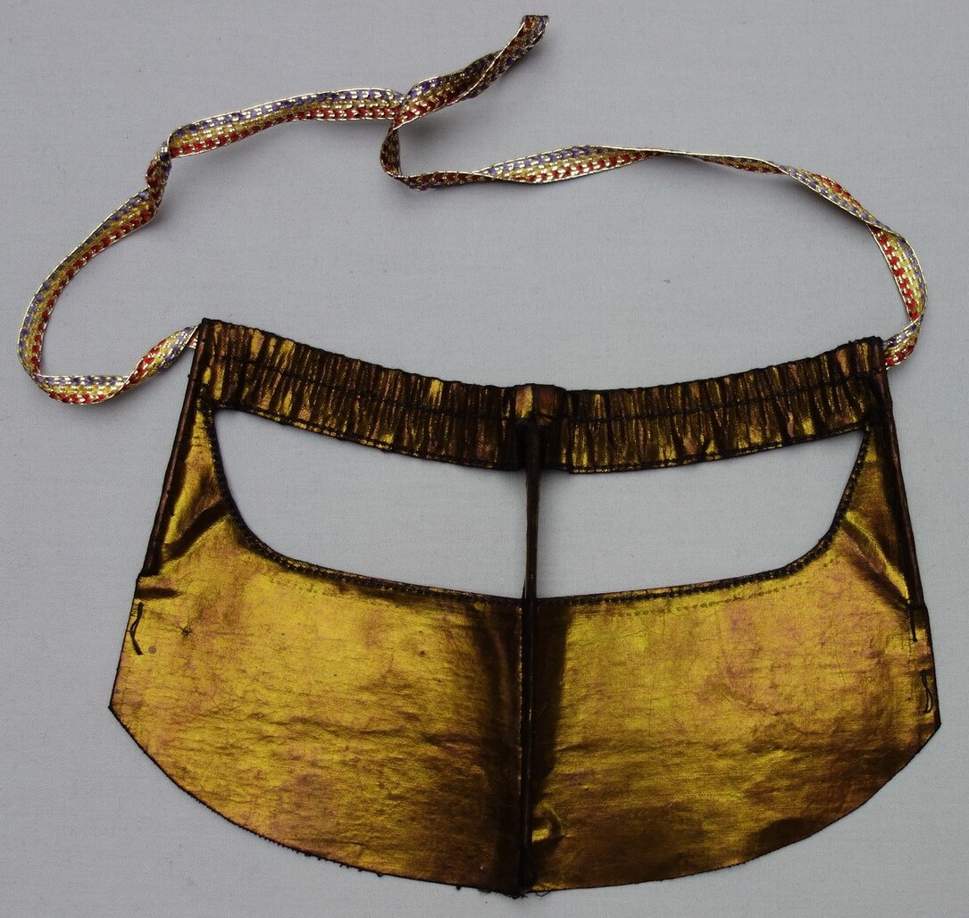 Battulah face mask for an Arab or Baluch woman from southern Iran, late 20th century (TRC 2001.0039).