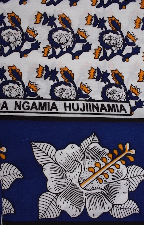 Detail of a 2009 kanga from Kenya. The full text is: "YALIYO MSIBU PUNDA NGAMIA HUJINAMIA", which means 'If something bad happens to the donkey, the camel will also suffer'. In other words, if you hurt me (the wife), you (the husband) will suffer'(TRC 2010.0002)