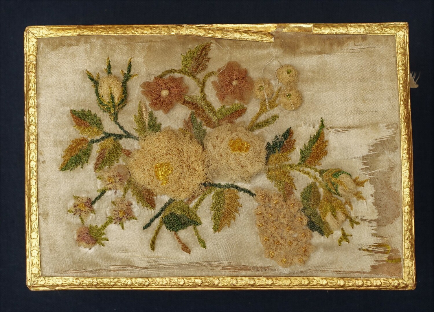 Lid of cardboard box that contained the bridal treasure, photographed from above (TRC 2014.1060e).