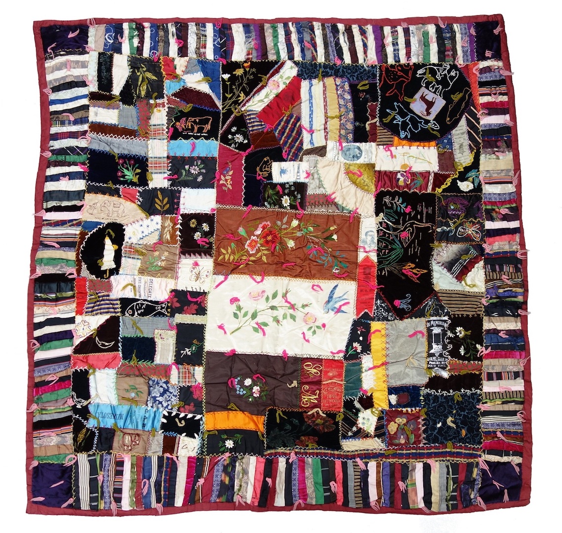 Fig. 1. Crazy quilt made from a variety of materials, as well as embroidered panels, painted panels and ribbons from various Republican political rallies. USA, 1890s (TRC 2019.2925).