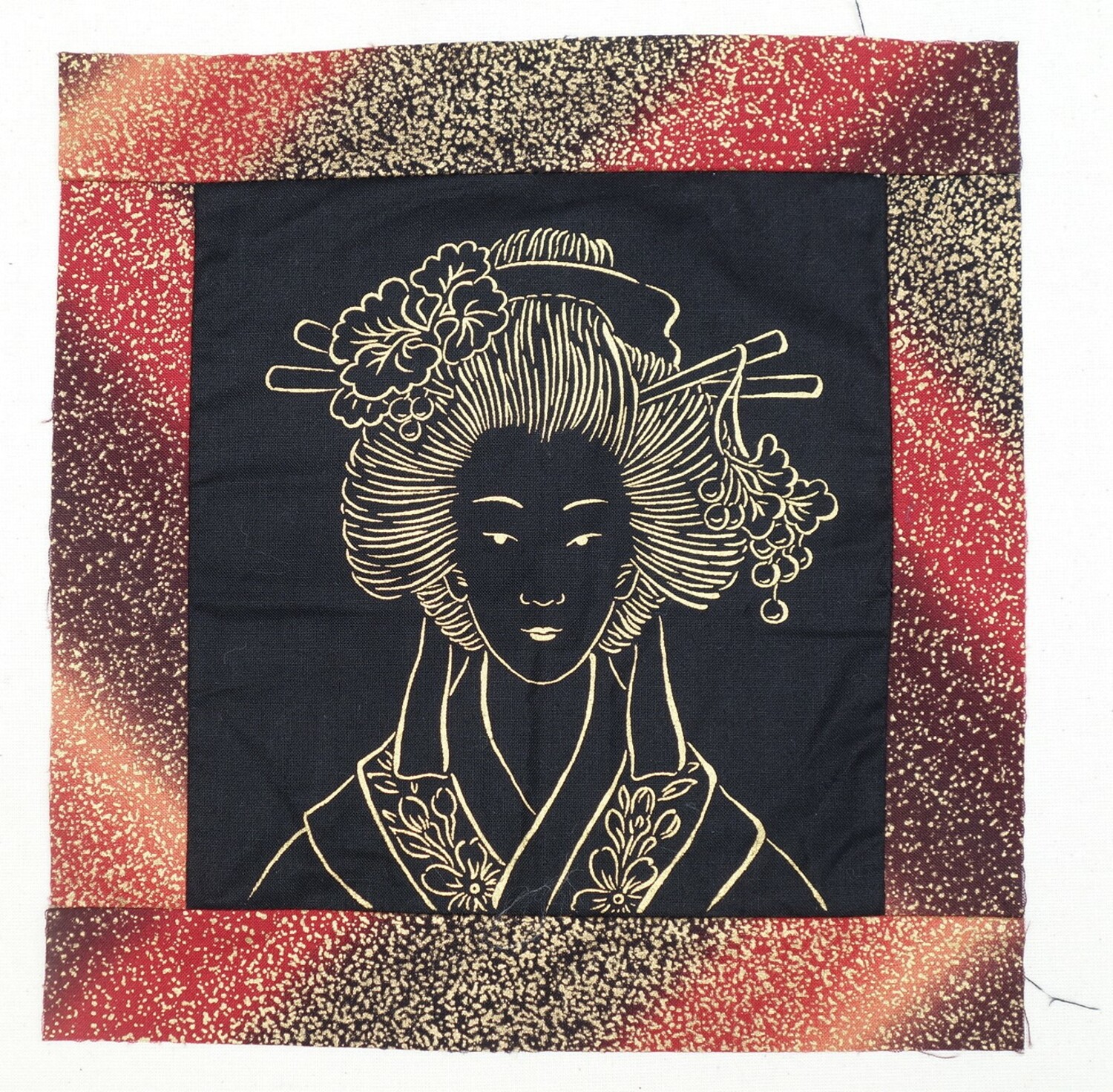 Early 21st century quilting block with a machine embroidered depiction of a Japanese woman, The Netherlands (TRC 2020.2508).