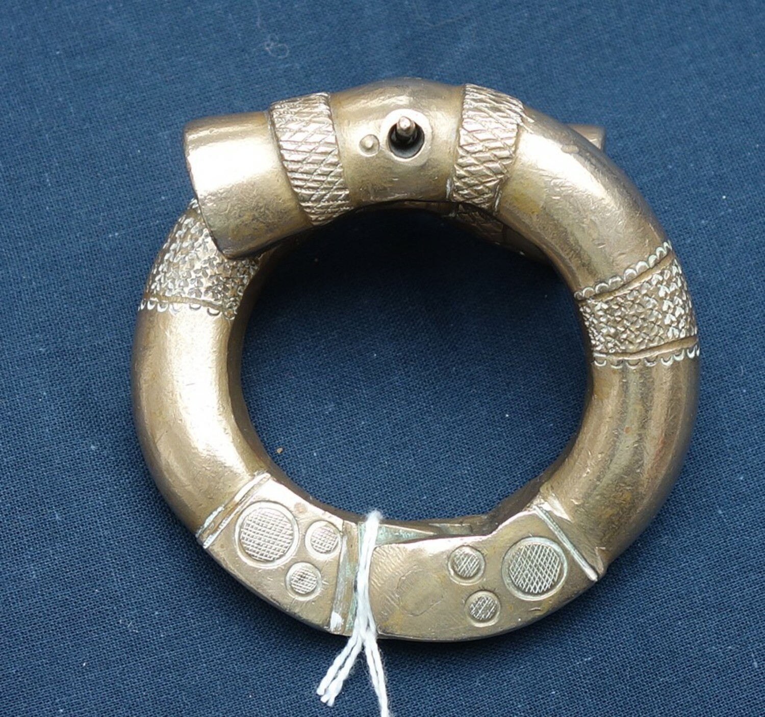 Metal bangle from West Africa, 20th century (TRC 2021.2081).