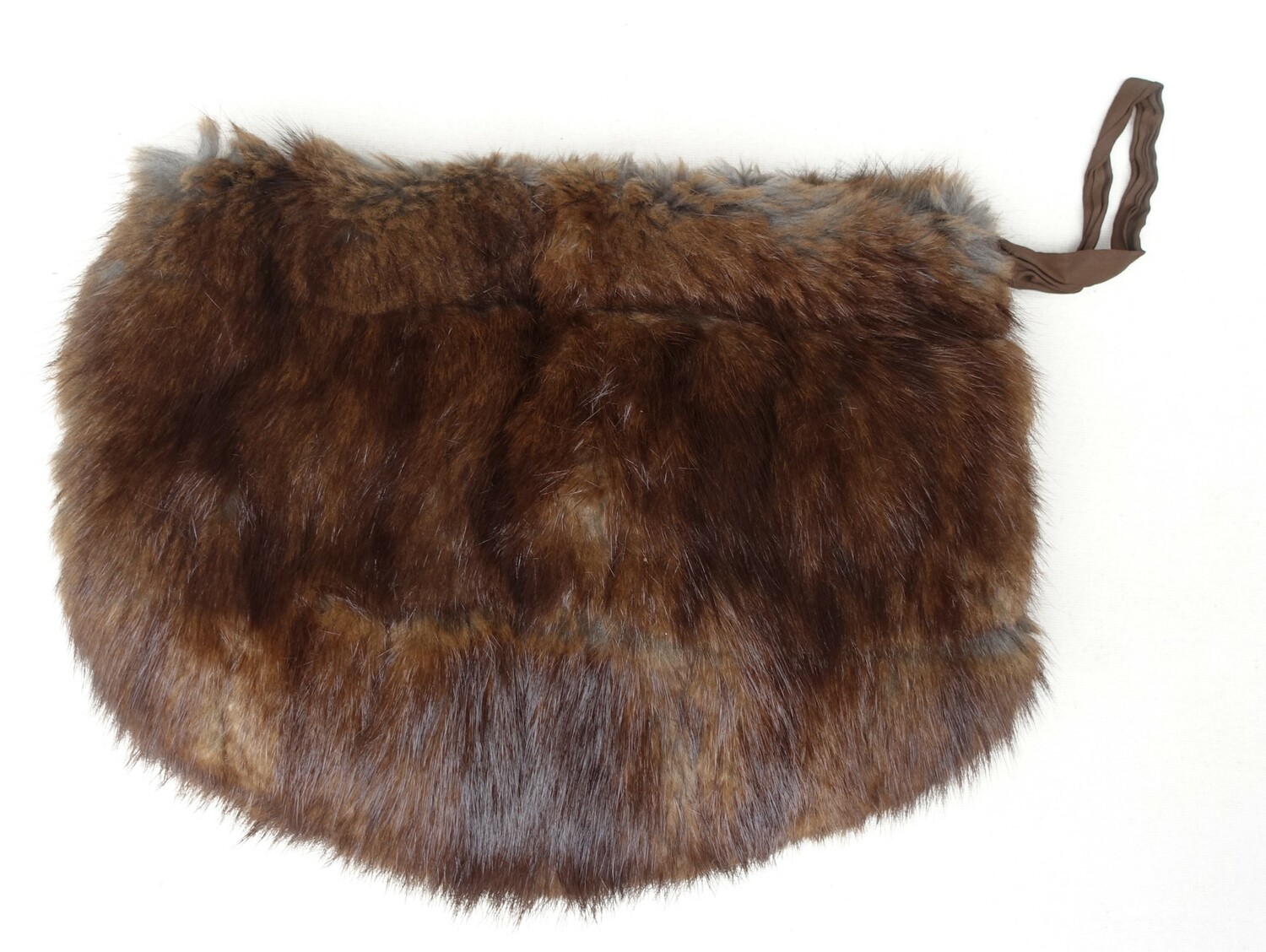 Brown muff made from muskrat and lined with pale brown silk. Canada, mid-20th century (TRC 2023.0627a).