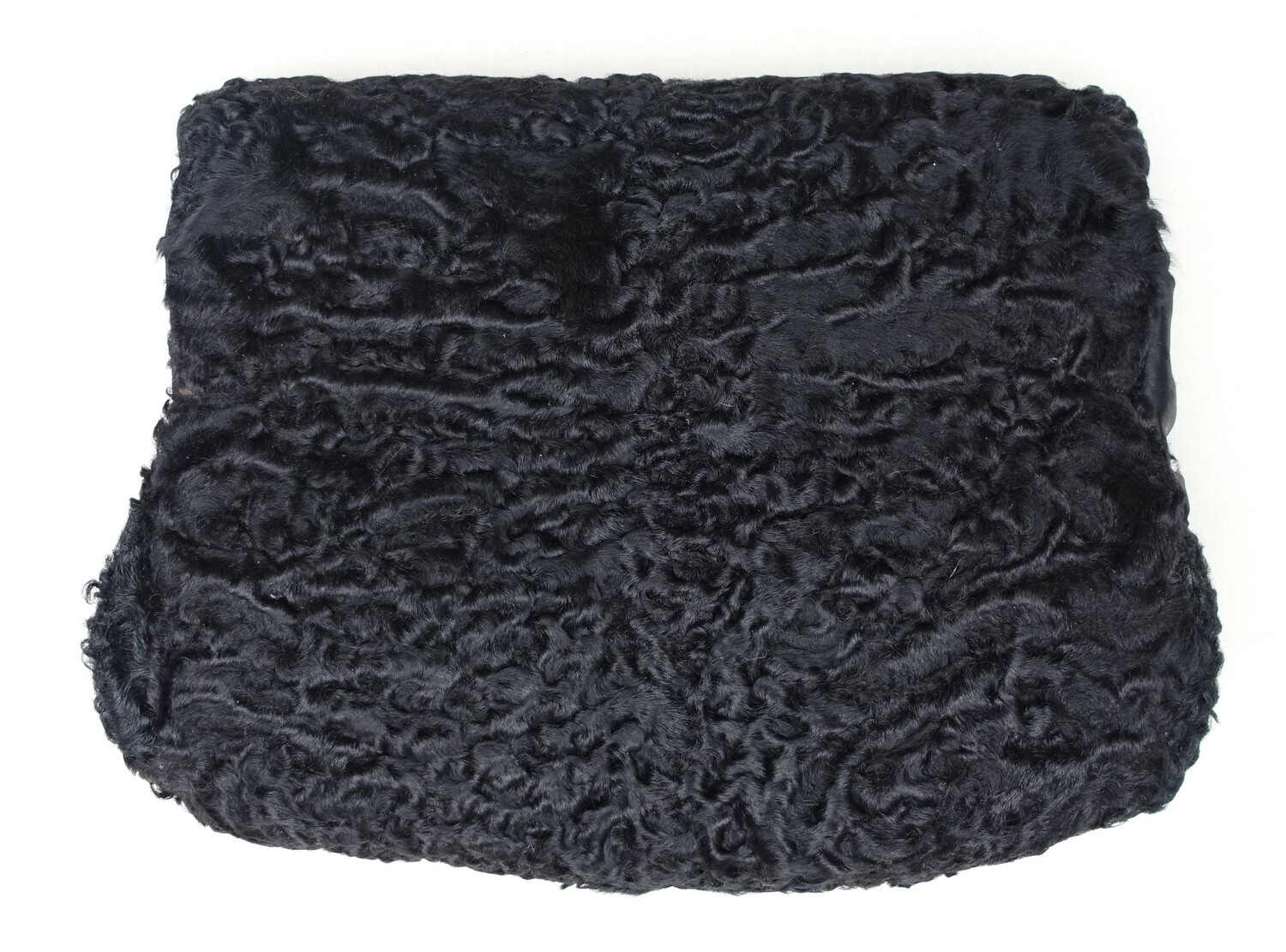Muff made from black astrakhan and lined with black cloth. The Netherlands, mid-20th century (TRC 2023.0630).