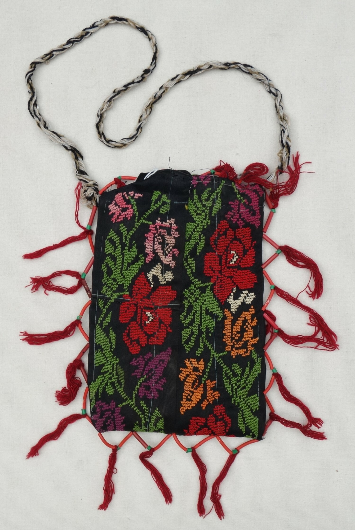 Fig. 4. Kohl bag made from strips of black cloth with embroidered, stylised flowers. Jordan, 1990s (TRC 2023.1032).