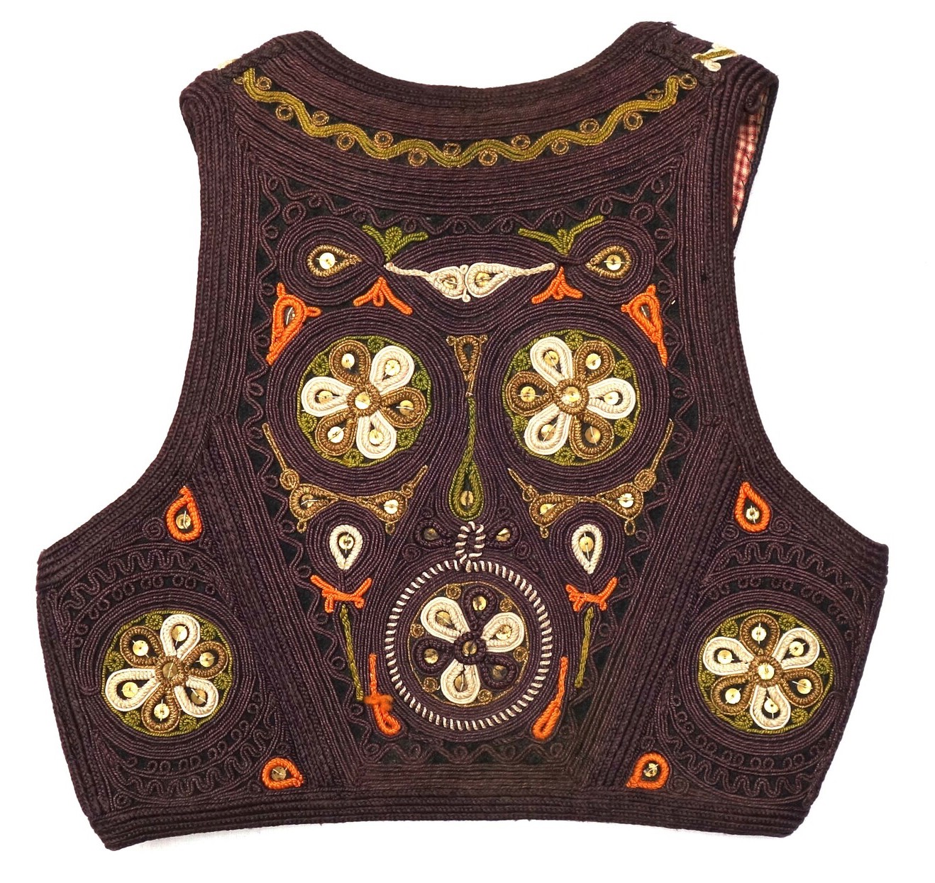 Fig. 5. Back of a waistcoat made of a black cloth with applied cords (passementerie). Former Yogoslavia, 20th century (TRC 2025.0241).