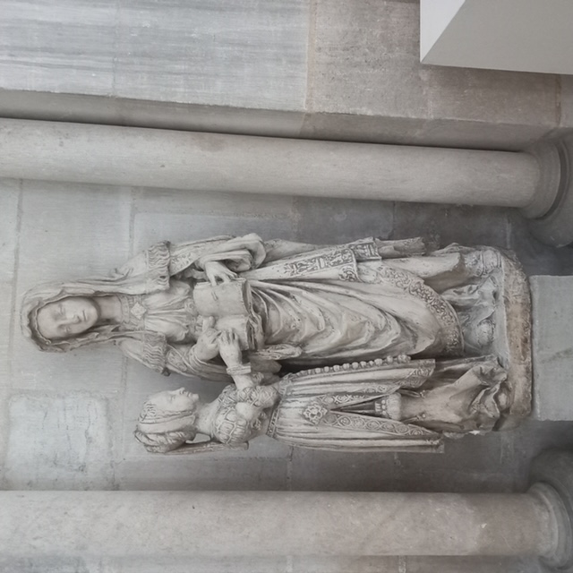 Medieval statue of the Virgin Mary being taught by St Elizabeth (?). Troyes Cathedral. The statue  shows the rich garments of Mary and her teacher. Photograph by author.  
