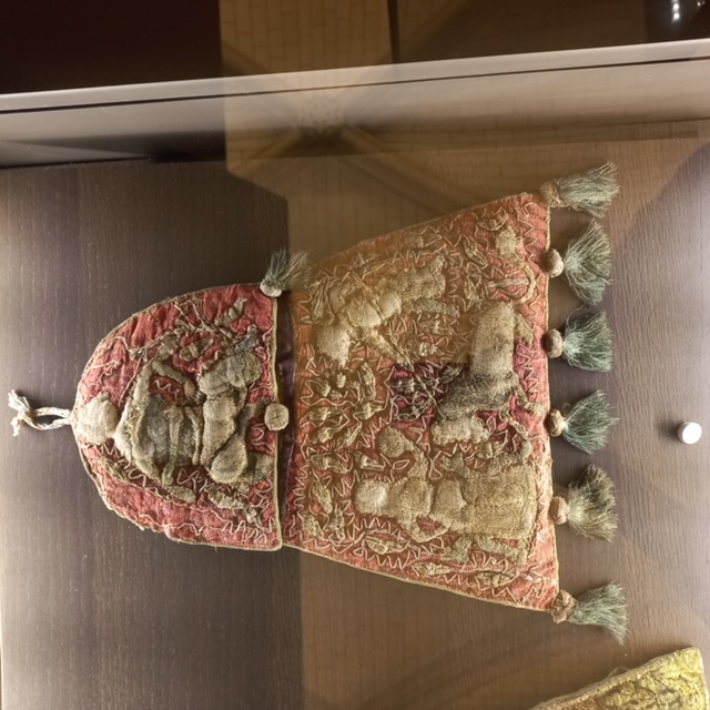 Embroidered 13th century aumonière with stump work. Troyes Cathedral. Photograph by author.