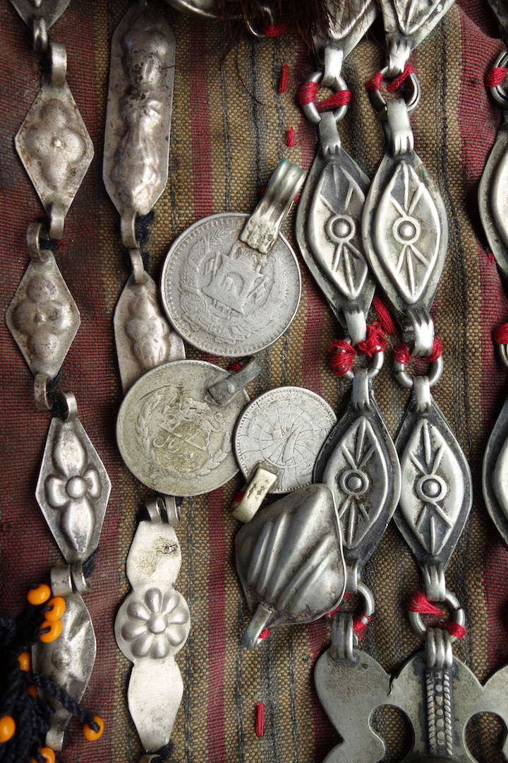 Coins and other amulets on Turkmen tunic, 1980s (TRC 2023.0477).