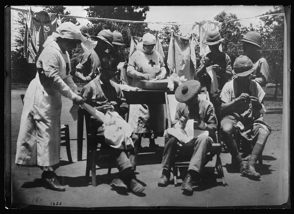 British wounded soldiers sewing for Syrian/Palestinian refugees.
