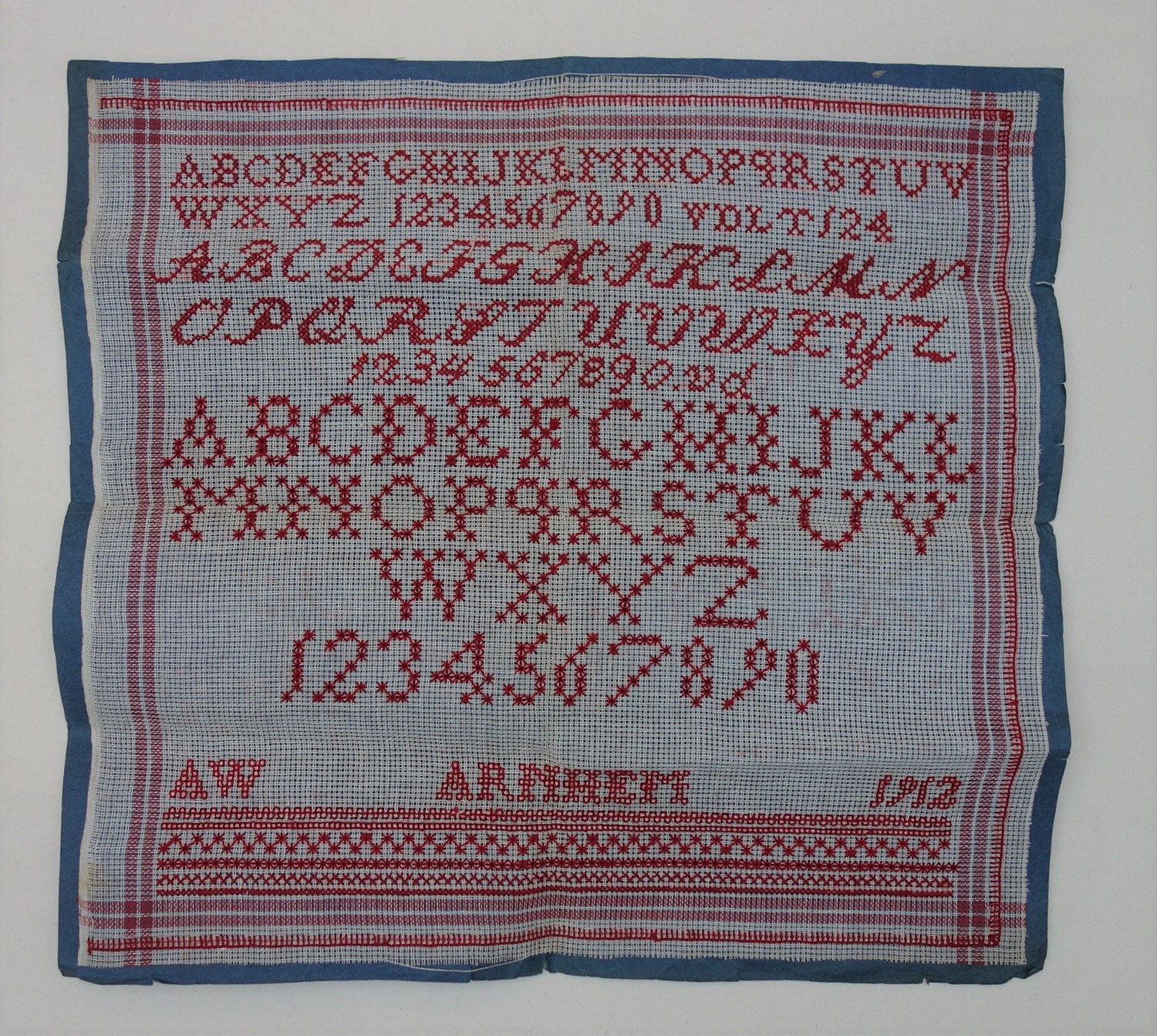 Sampler with the text A W Arnhem 1912 (TRC 2018.0467).