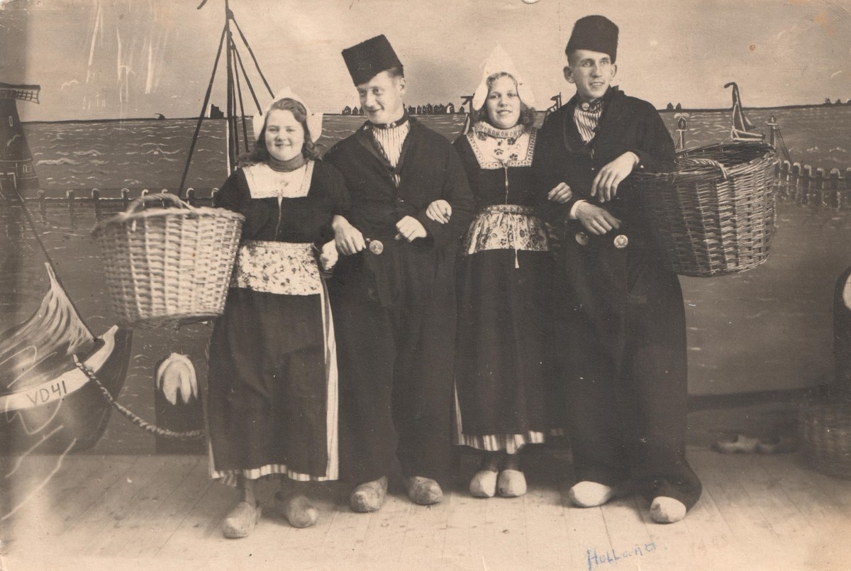 Postcard with two German soldiers and two women in Volendam-style costume, 1943 (TRC 2019.1436).