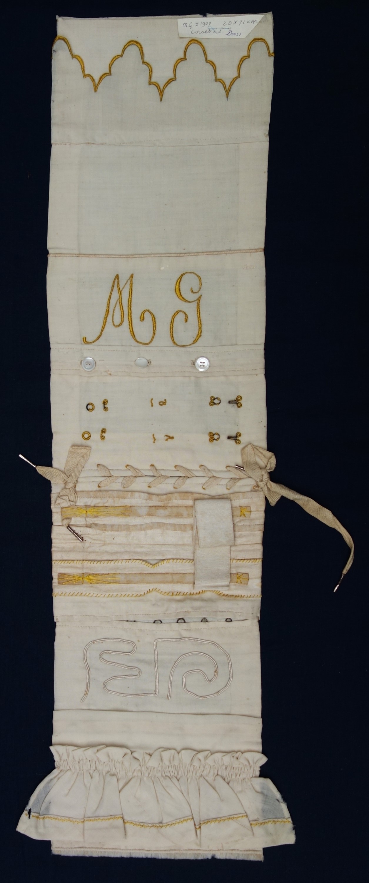 Sampler dedicated to elements of corset making including pleats, boning, ties, lacings, hooks and eyes, buttons, gathers, etc. Belgium or the Netherlands, c. 1900. (TRC 2023.2780).