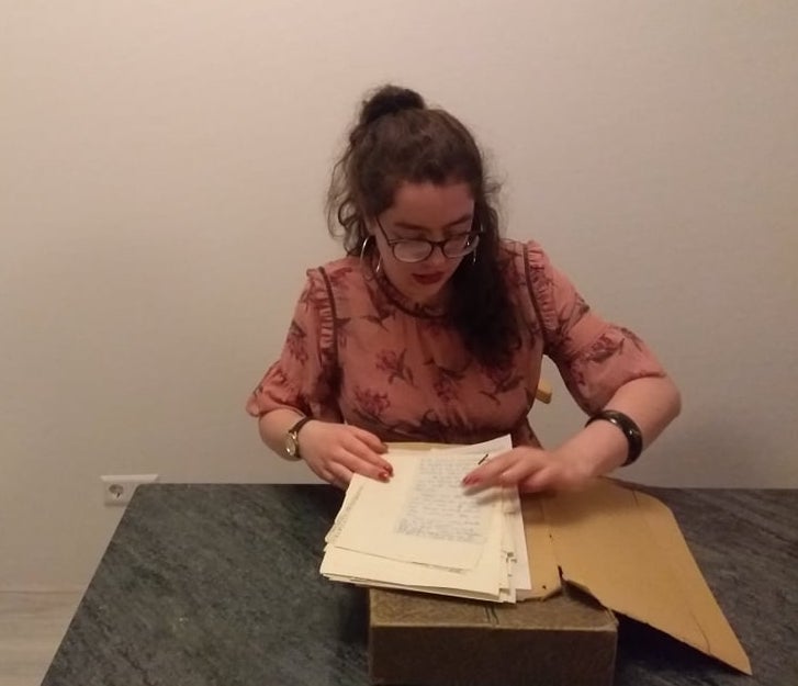 TRC volunteer, Alice Jaspars, studying the Robert Charleston correspondence housed in the TRC library (February 2019).