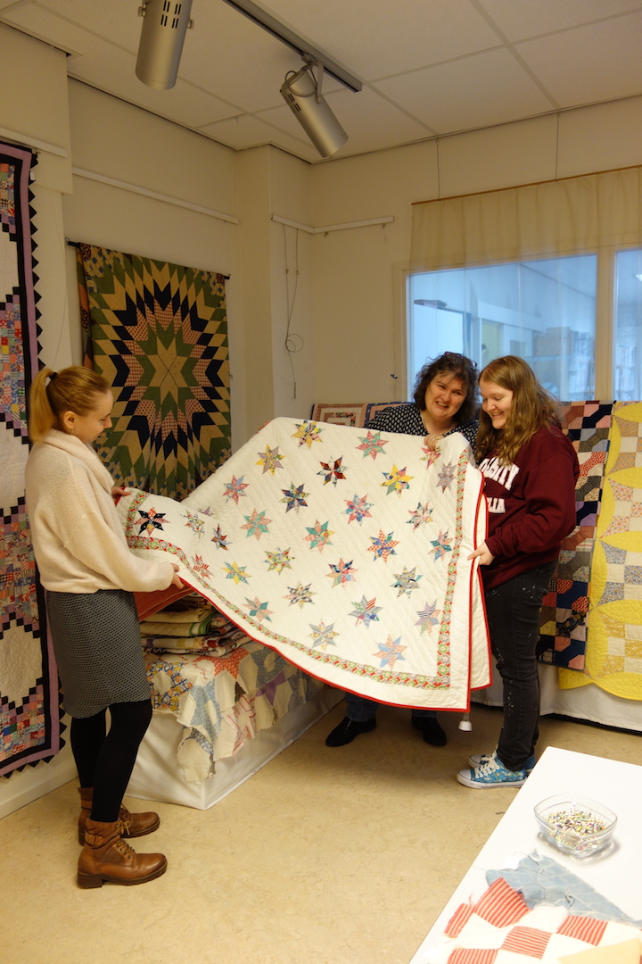 Three TRC volunteers enjoying setting up the exhibition.