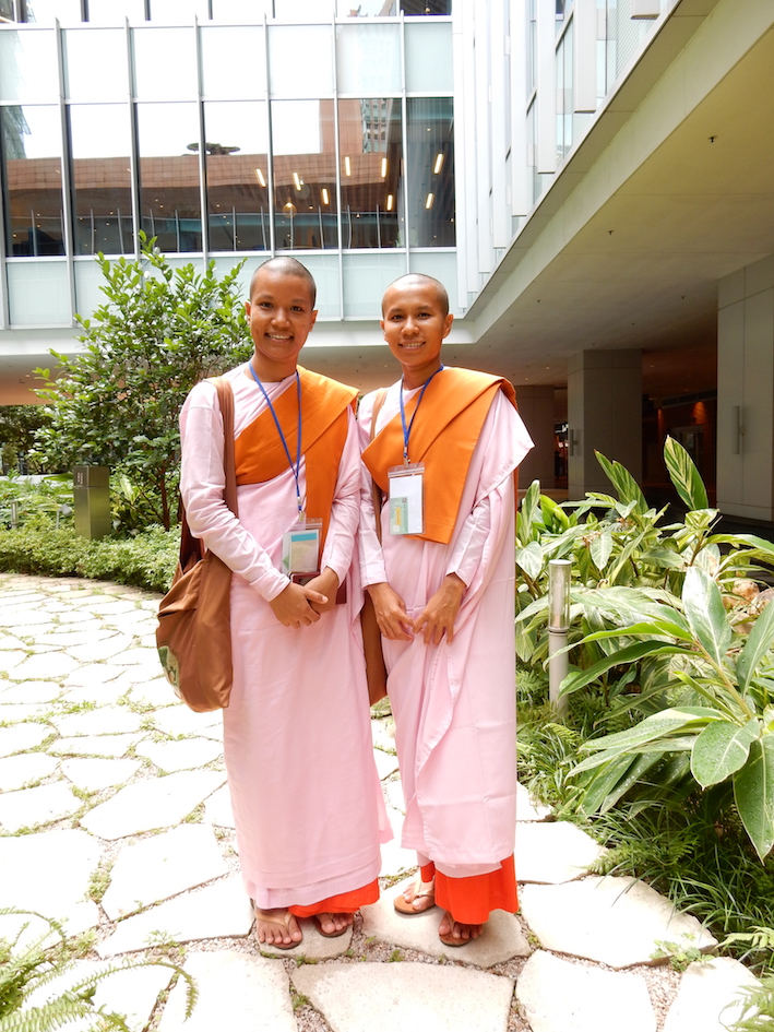 Two Buddhist nuns in pink. Photograph by Shelley Anderson.