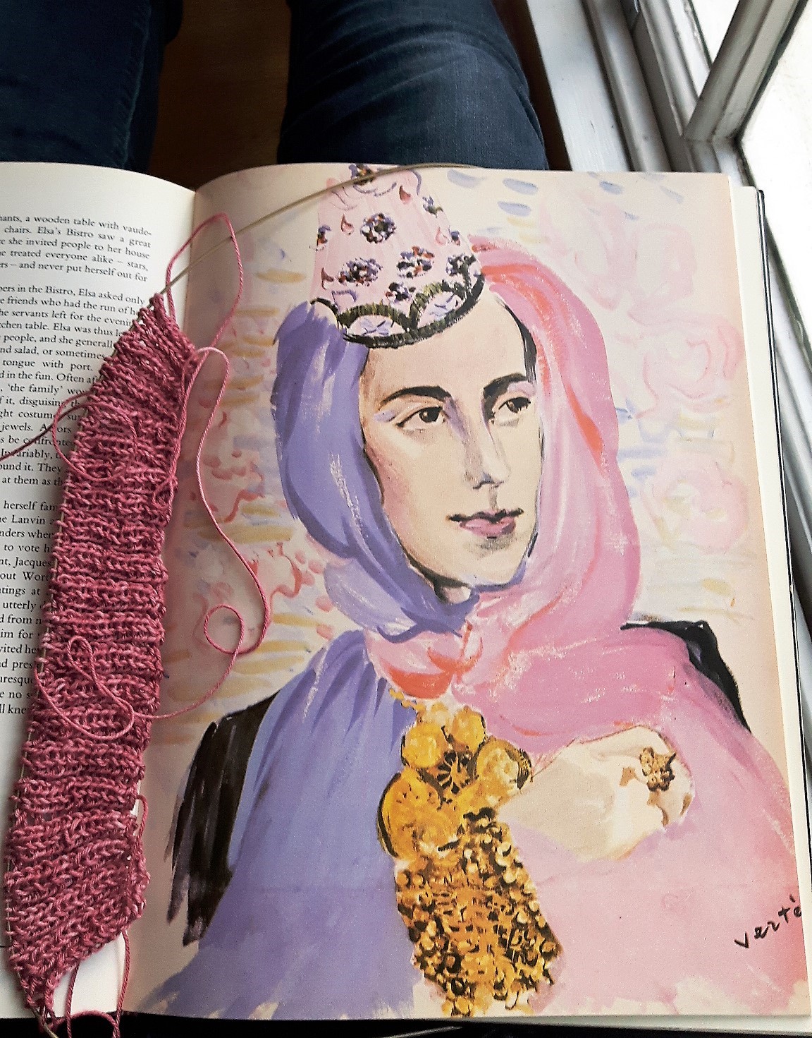 Multitasking: Reading a book on fashion designer Elsa Schiaparelli while knitting a jumper from a 1940s pattern. Photograph: Nelleke Honcoop.