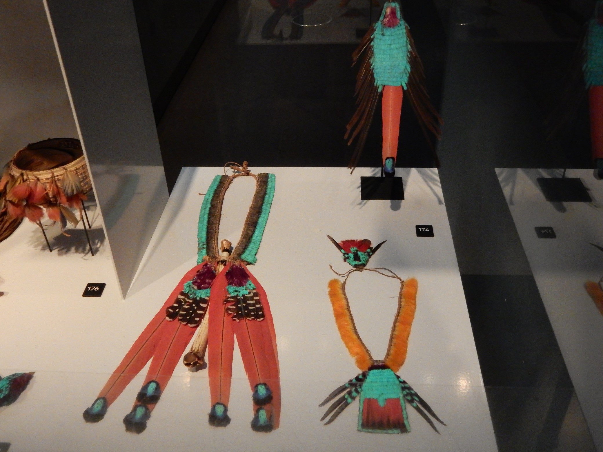 Showcase with feather jewellery from Brazil, in the exhibition "Jewellery: Made by, worn by", in the Volkenkunde Museum, Leiden. Photograph: Shelley Anderson.