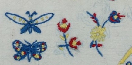 Detail of sampler TRC 2014.0075, showing the lines of the original stamps.