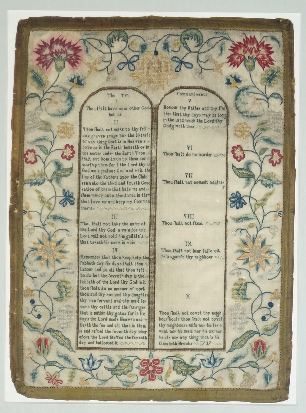 Embroidered sampler worked by Elizabeth Brooks in England, in 1737, showing the two tablets with the Ten Commandments (TRC 2020.3317).