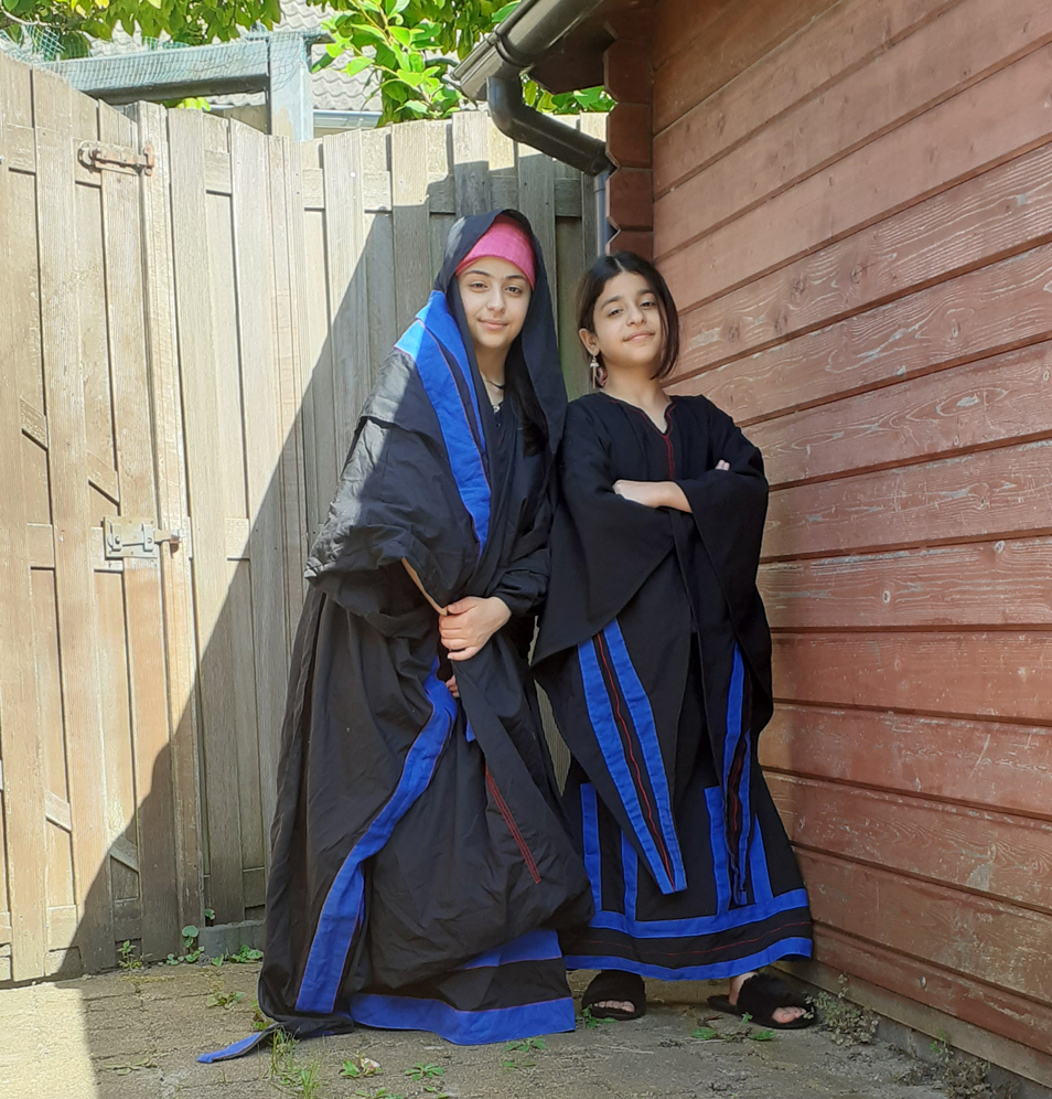 Two models in the Netherlands, wearing replica Al Salt khalaga dresses, made by the TRC. Photograph by Fatima Abbadi.