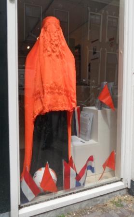 Football is everywhere. A bright orange burqa from Afghanistan in the TRC window