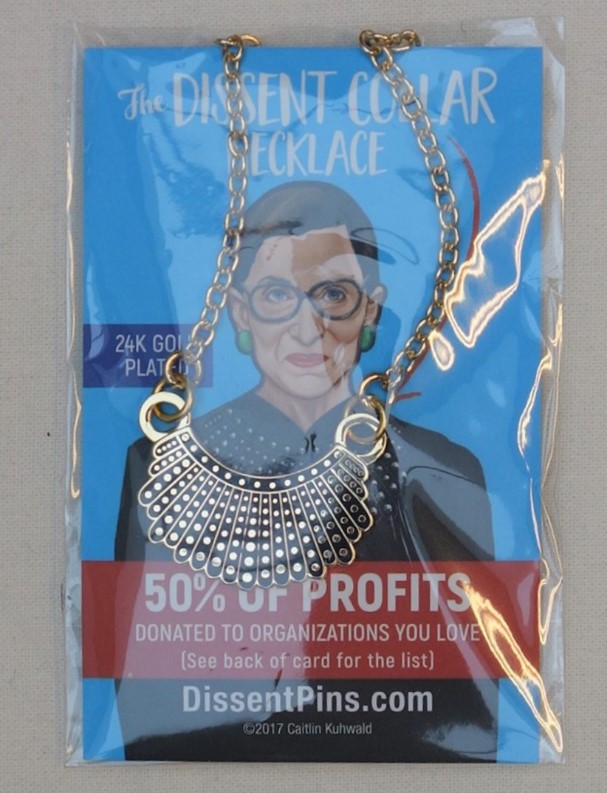 Package containing miniature Black and Gold Dissent Collar, USA 2018 (TRC 2018.3367).