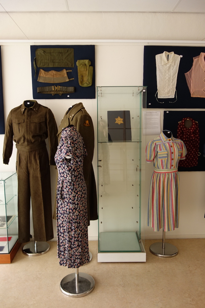 Military uniforms from British depots worn by Dutch military just after the war. The Star of David, placed in a glass showcase in the centre, reflects the tragic fate of the Jewish community in The Netherlands.
